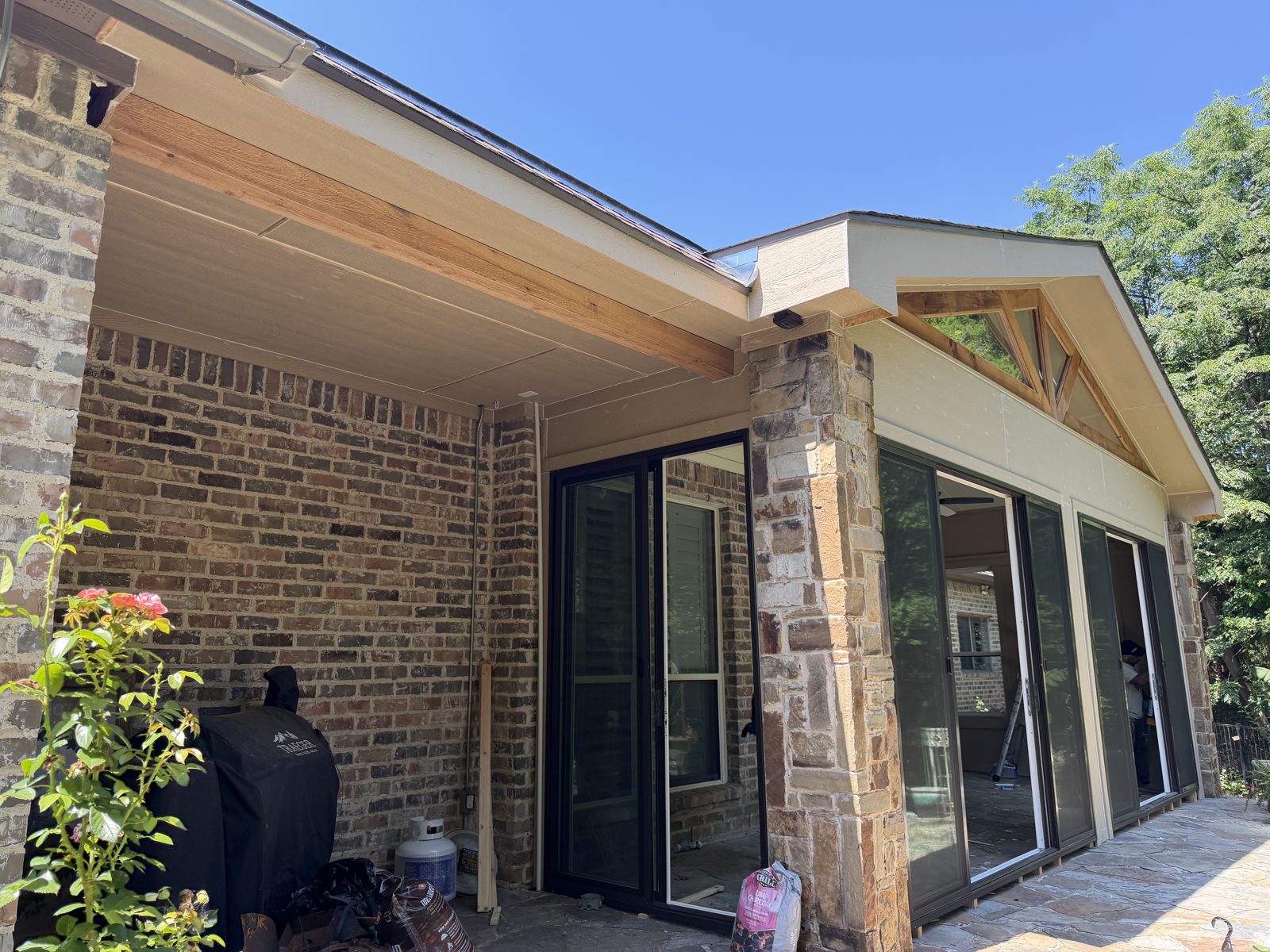 Gable patio enclosure with cedar truss in Parker County