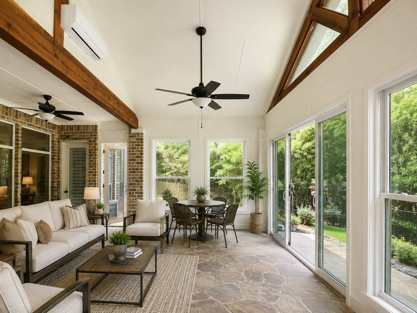 Glass-walled patio enclosure with sliding doors